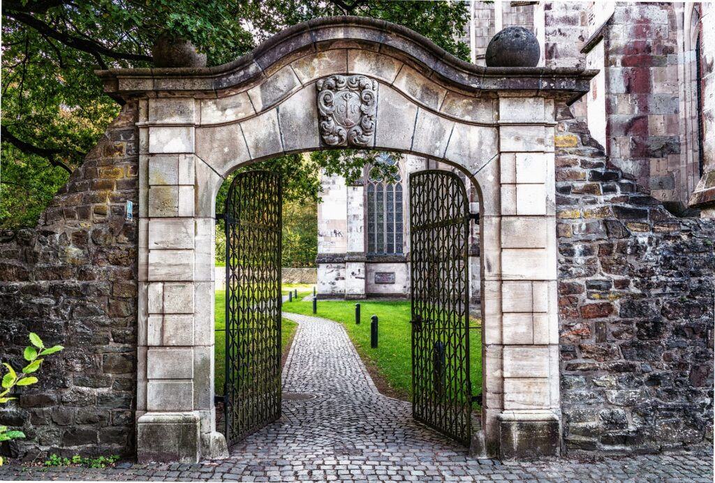 wrought Iron gate and stone wall